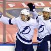 SUNRISE, FLORIDA - FEBRUARY 13: Alexander Volkov #92 of the Tampa Bay Lightning celebrates his first NHL goal at 10:58 of the third period against the Florida Panthers and is joined by Jan Rutta #44 (r)  at the BB&T Center on February 13, 2021 in Sunrise, Florida. (Photo by Bruce Bennett/Getty Images)