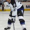 WASHINGTON D.C. - NOVEMBER 14:  Defenseman Brad Lukowich #37 of the Tampa Bay Lightning waits for the puck during the game against the Washington Capitals at the MCI Center on November 14, 2003 in Washington D.C.  The Lightning defeated the Capitals 5-2.  (Photo by Mitchell Layton/Getty Images)