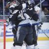 16 Dec 2000: Brad Richards #19 of the Tampa Bay Lightning celebrates with teammates Alexander Kharitonov #36 and Fredrik Modin #33 during the game against the Los Angeles Kings at the STAPLES Center in Los Angeles, California. The Lightning defeated the Kings 4-3.Mandatory Credit: Kellie Landis  /Allsport