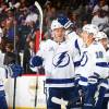 NEW YORK, NY - MARCH 22: Mikhail Sergachev #98 of the Tampa Bay Lightning celebrates his second-period goal against the New York Islanders with teammates Brayden Point #21, Ondrej Palat #18 and Tyler Johnson #9 at Barclays Center on March 22, 2018 in New York City.  (Photo by Mike Stobe/NHLI via Getty Images)