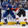 TAMPA, FL - DECEMBER 20: Braydon Coburn #55 of the Tampa Bay Lightning fights against Mark Borowiecki #74 of the Ottawa Senators during first period at the Amalie Arena on December 20, 2015 in Tampa, Florida.  (Photo by Scott Audette/NHLI via Getty Images)