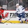 NEWARK, NJ - FEBRUARY 07:  Brendan Mikkelson #29 of the Tampa Bay Lightning in action against Adam Henrique #14 of the New Jersey Devils at the Prudential Center on February 7, 2013 in Newark, New Jersey. The Devils defeated the Lightning 4-2.  (Photo by Jim McIsaac/Getty Images)