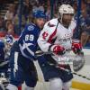 TAMPA, FL - JANUARY 19:   Cory Conacher #89 of the Tampa Bay Lightning tries to clear Joel Ward #42 of the Washington Capitals away from the goal at the Tampa Bay Times Forum on January 19, 2013 in Tampa, Florida.  (Photo by Scott Audette/NHLI via Getty Images)