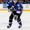 TAMPA, FL - OCTOBER 31:  Drew Miller #16 of the Tampa Bay Lightning skates into the zone with the puck against the New Jersey Devils at the St. Pete Times Forum on October 31, 2009 in Tampa, Florida.  (Photo by Scott Audette/NHLI via Getty Images)