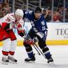 TAMPA, FL - OCTOBER 10:  Jussi Jokinen #36 of the Carolina Hurricanes battles against Drew Miller #16 of the Tampa Bay Lightning at the St. Pete Times Forum on October 10, 2009 in Tampa, Florida.  (Photo by Scott Audette/NHLI via Getty Images)