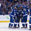 TAMPA, FL - JUNE 6: Jason Garrison #5 of the Tampa Bay Lightning celebrates his goal with teammates against Andrew Desjardins #11 and the Chicago Blackhawks during the third period in Game Two of the 2015 NHL Stanley Cup Final at Amalie Arena on June 6, 2015 in Tampa, Florida.  (Photo by Scott Audette/NHLI via Getty Images)