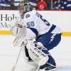 NEWARK, NJ - FEBRUARY 26: Kristers Gudlevskis #50 of the Tampa Bay Lightning defends his net during pregame warmups prior to the game agaiinst the New Jersey Devils at the Prudential Center on February 26, 2016 in Newark, New Jersey. (Photo by Andy Marlin/NHLI via Getty Images)