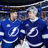 TAMPA, FL - APRIL 6: Goalie Louis Domingue #70 and Andrei Vasilevskiy #88 of the Tampa Bay Lightning celebrate the win against the Buffalo Sabres at Amalie Arena on April 6, 2018 in Tampa, Florida. (Photo by Scott Audette/NHLI via Getty Images)"n