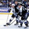 16 Dec 2000:  Mike Johnson #10 of the Tampa Bay Lightning passes the puck as teammate Martin St. Louis #26 and Lubomir Visnovsky #24 of Los Angeles Kings keep their eyes on it during the game at the STAPLES Center in Los Angeles, California. The Lightning defeated the Kings 4-3.Mandatory Credit: Kellie Landis  /Allsport