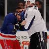 NEW YORK - FEBRUARY 14: Matt Walker #8 of the Tampa Bay Lightning tries to pull the helmet off of Brandon Prust #8 during a fight in the first period of an NHL game at Madison Square Garden on February 14, 2010 in New York, New York.  (Photo by Paul Bereswill/Getty Images)