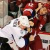 GLENDALE, AZ - NOVEMBER 16:  Paul Bissonnette #12 of the Phoenix Coyotes and Matt Walker #8 of the Tampa Bay Lightning mix it up on November 16, 2009 at Jobing.com Arena in Glendale, Arizona.  (Photo by Norm Hall/NHLI via Getty Images)