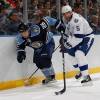 SUNRISE, FL - SEPTEMBER 24: Michal Repik #26 of the Florida Panthers and Mattias Ohlund #5 of the Tampa Bay Lightning skate after a loose puck on September 24, 2011 at the BankAtlantic Center in Sunrise, Florida. (Photo by Joel Auerbach/Getty Images)