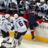 WASHINGTON, DC - May 1, 2011:  Washington Capitals forward Matt Bradley (#10) is checked into the Tampa Bay Lightning players bench by forward Ryan Malone (#6) during Game Two of the Eastern Conference Semifinals NHL playoff series at Verizon Center.