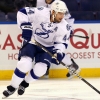 ST. LOUIS - SEPTEMBER 20: Nate Thompson #44 of the Tampa Bay Lightning moves the puck up ice against Jonathan Cheechoo #18 of the St. Louis Blues during a pre-season game at the Scottrade Center on September 20, 2011 in St. Louis, Missouri.  (Photo by Dilip Vishwanat/Getty Images)