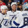 BUFFALO, NY - NOVEMBER 05: Nikita Nesterov #89, Victor Hedman #77 and Andrei Vasilevskiy #88 of the Tampa Bay Lightning celebrate their 4-1 victory against the Buffalo Sabres in an NHL game on November 5, 2015 at the First Niagara Center in Buffalo, New York.  (Photo by Bill Wippert/NHLI via Getty Images)