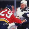 Canadian hockey player Rudy Poeschek of the Tampa Bay Lightning fights a Florida Panther during a game, 1990s. (Photo by Bruce Bennett Studios via Getty Images Studios/Getty Images)