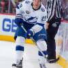 DETROIT, MI - JANUARY 07: Slater Koekkoek #29 of the Tampa Bay Lightning skates up ice with the puck against the Detroit Red Wings during an NHL game at Little Caesars Arena on January 7, 2017 in Detroit, Michigan. The Lightning defeated the Wings 5-2. (Photo by Dave Reginek/NHLI via Getty Images)