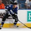 TAMPA, FL - OCTOBER 10: Stephane Veilleux #19  of the Tampa Bay Lightning passes the ball along the boards against the Carolina Hurricanes at the St. Pete Times Forum on October 10, 2009 in Tampa, Florida.  (Photo by Scott Audette/NHLI via Getty Images)