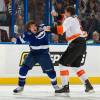 TAMPA, FL - NOVEMBER 9:   Steve Downie #9 of the Tampa Bay Lightning fights Braydon Coburn #5 of the Philadelphia Flyers at the St. Pete Times Forum on November 9, 2011 in Tampa, Florida.  (Photo by Scott Audette/NHLI via Getty Images)