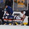 BOSTON, MA - NOVEMBER 11: Steven Stamkos #91 of the Tampa Bay Lightning is taken out on a stretcher after hitting his leg on the goal post during a play against the Boston Bruins at the TD Garden on November 11, 2013 in Boston, Massachusetts.  (Photo by Brian Babineau/NHLI via Getty Images)