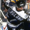 19 Dec 1993: Defenseman Doug Bodger of the Buffalo Sabres and rightwinger Tim Bergland of the Tampa Bay Lightning fight during a game at Memorial Auditorium in Buffalo, New York.