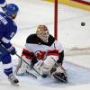 TAMPA, FL - APRIL 12: Tyler Johnson #9 of the Tampa Bay Lightning watches the puck fly into the net for a goal against goalie Keith Kinkaid #1 of the New Jersey Devils in Game One of the Eastern Conference First Round during the 2018 NHL Stanley Cup Playoffs at Amalie Arena on April 12, 2018 in Tampa, Florida. (Photo by Mike Carlson /NHLI via Getty Images)