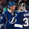 TAMPA, FL - OCTOBER 9: Victor Hedman #77 of the Tampa Bay Lightning congratulates goalie Ben Bishop #30 after the win against the Florida Panthers at the Amalie Arena on October 9, 2014 in Tampa, Florida.  (Photo by Scott Audette/NHLI via Getty Images)