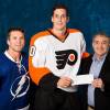 TAMPA, FL - NOVEMBER 27:  Tampa Bay Lightning Owner Jeffrey Vinik and Martin St. Louis #26 present a check to Vincent Lecavalier #40 of the Philadelphia Flyers on behalf of the The Vincent Lecavalier Foundation as part of the Tampa Bay Lightning's Community Hero Program prior to the game at the Tampa Bay Times Forum on November 27, 2013 in Tampa, Florida.  (Photo by Scott Audette/NHLI via Getty Images)