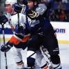 2000 Season: Tampa's Wendell Clark and Islander Kenny Jonsson battle for position in front.  (Photo by Jim Leary/Getty Images)