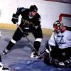 2000 Season: Dallas' Jon Sim shoots on Tampa's Zac Bierk.  (Photo by Jim McIsaac/Getty Images)