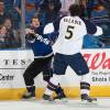 TAMPA, FL - JANUARY 23:  Boris Valabik #5 of the Atlanta Thrashers fights along the boards against Zenon Konopka #28 of the Tampa Bay Lightning during the first period at the St. Pete Times Forum on January 23, 2010 in Tampa, Florida. (Photo by Scott Audette/NHLI via Getty Images)