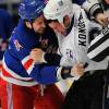 NEW YORK - FEBRUARY 14:  Aaron Voros #34 of the New York Rangers fights with Zenon Konopka #28 of the Tampa Bay Lightning as both players received fighting penalties during the first period of an NHL game at Madison Square Garden on February 14, 2010 in New York, New York. The Rangers won 5-2. (Photo by Paul Bereswill/Getty Images)