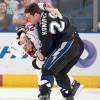 TAMPA, FL - APRIL 6:  Zenon Konopka #28 of the Tampa Bay Lightning fights Tom Kostopoulos #29 of the Carolina Hurricanes during the second period at the St. Pete Times Forum on April 6, 2010 in Tampa, Florida. (Photo by Scott Audette/NHLI via Getty Images)