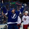 TAMPA, FL - JANUARY 24:  Mike Angelidis #59 of the Tampa Bay Lightning celebrates his first goal in the NHL during the first period against the Columbus Blue Jackets at the Tampa Bay Times Forum on January 24, 2012 in Tampa, Florida.  (Photo by Scott Audette/NHLI via Getty Images)