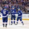 TAMPA, FL - APRIL 28: Tampa Bay Lightning defender Mikhail Sergachev (98) celebrates his goal with Tampa Bay Lightning center Yanni Gourde (37) and Tampa Bay Lightning center Tyler Johnson (9) during the second period of an NHL Stanley Cup Eastern Conference Playoffs game between the Boston Bruins and the Tampa Bay Lightning on April 28, 2018, at Amalie Arena in Tampa, FL. (Photo by Roy K. Miller/Icon Sportswire via Getty Images)