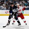 TAMPA, FL - JANUARY 3:  Adam Hall #18 of the Tampa Bay Lightning sets up in front of the net against Joe Corvo #77 of the Carolina Hurricanes at the St. Pete Times Forum on January 3, 2009 in Tampa, Florida.  (Photo by Scott Audette/NHLI via Getty Images)